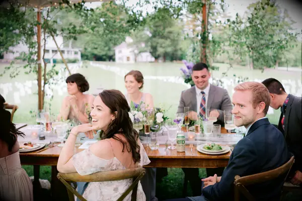 Guests sitting outdoors at vineyard wedding