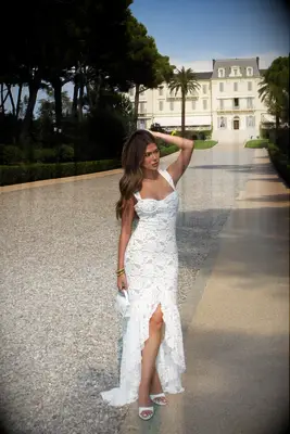 Lace bridal dress with ruffle leg slit