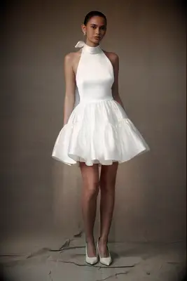 Mini white dress with high neck and ruffle skirt