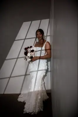 Model poses in wedding gown