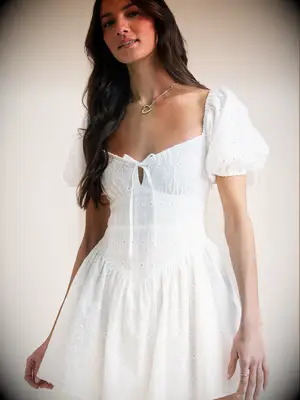 Charming short white dress with puff shoulders