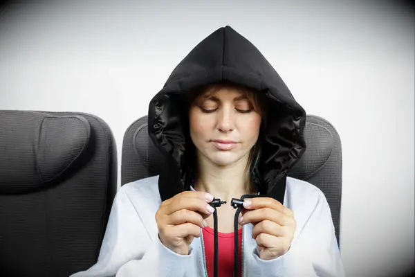 Woman wearing a sleep hoodie