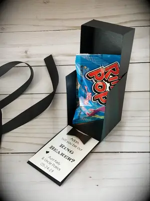 Black box with ring pop ring bearer proposal gift