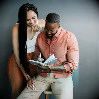 Couple writing in the couple