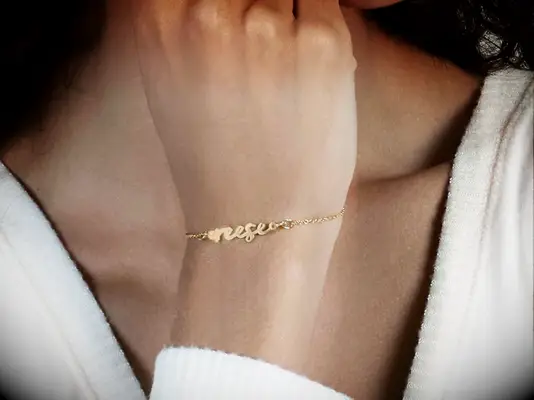 Gold chain with customizable name charm matching couples bracelets