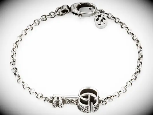 Silver Gucci bracelet with key charm relationship bracelet