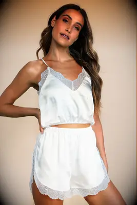 Woman wearing silk two piece pajama set