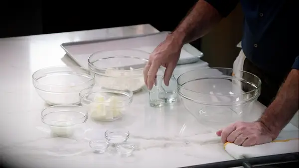 Man with ingredients at a cooking masterclass