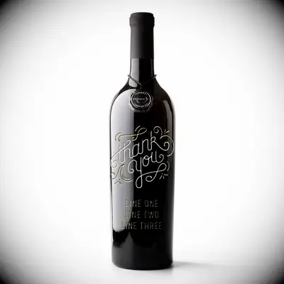 Personalized wine bottle engraved with the message 
