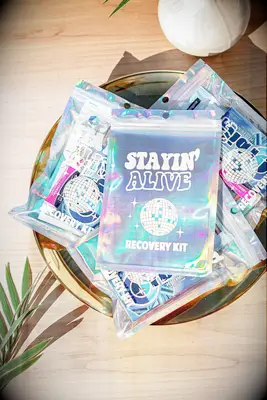 Hangover kits in glittery plastic bags that read Stayin