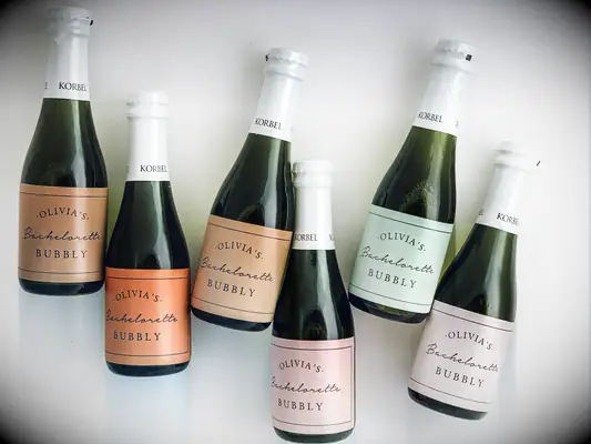 Mini champagne bottles with custom labels bachelorette party favors