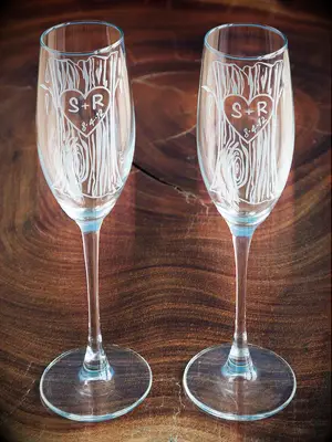 Set of champagne flutes with aboral etching engagement gift from parents