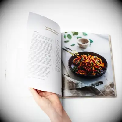 Person looking through a cookbook