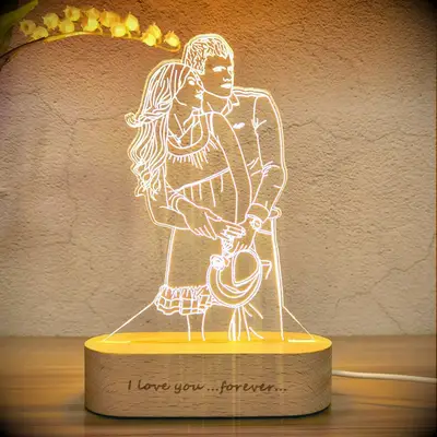 A beautiful custom photo lamp depicts a couple embracing. 
