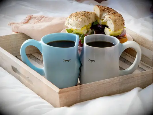 Two ceramic mugs with kissing faces 9 year anniversary gift