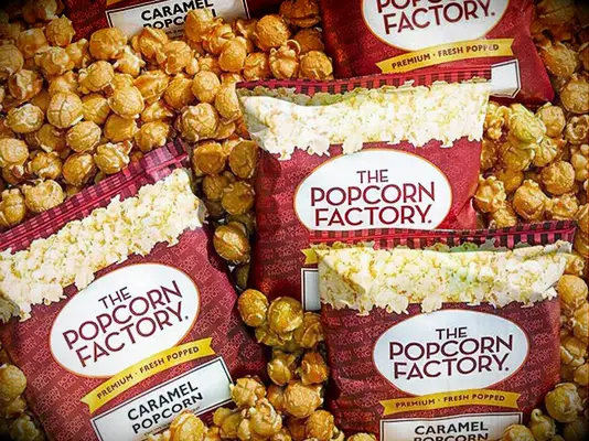 Bags of caramel corn from The Popcorn Factory fall wedding favors