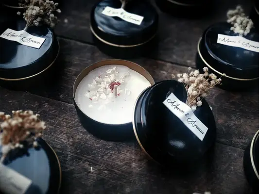 Personalized small candle holders with little bouquet taped on top