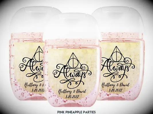 Pink pineapple hand sanitizer with gold Always and Deathly Hallows symbol sticker