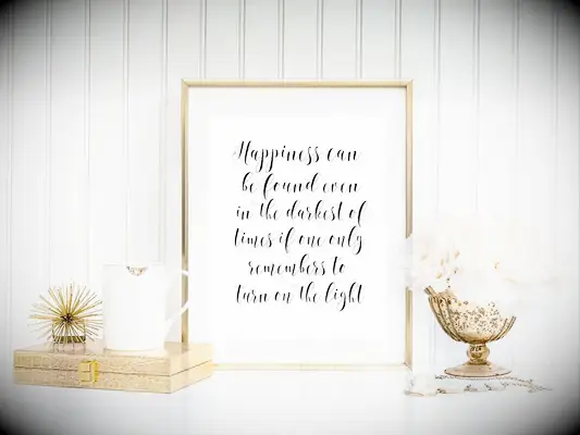 White print with black script reading: Happiness can be found even in the darkest of times if one only remembers to turn on the light 