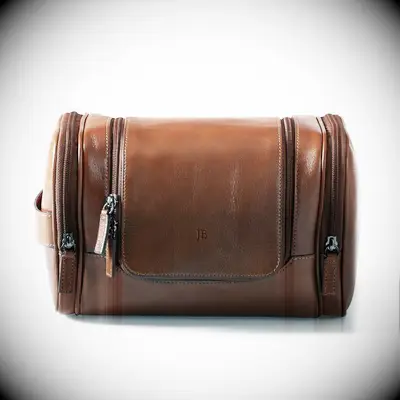 Monogrammed leather toiletry bag. 