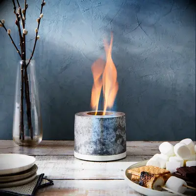 Small concrete personal fireplace. 