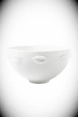 White serving bowl with lip impressions