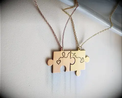 Matching puzzle piece couples necklaces