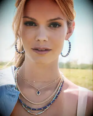 Blue hoop earrings by Kendra Scott. 