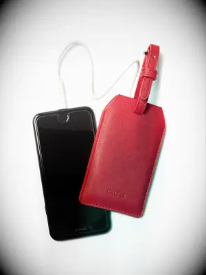 Portable charger luggage tag gift idea for 32nd anniversary. 