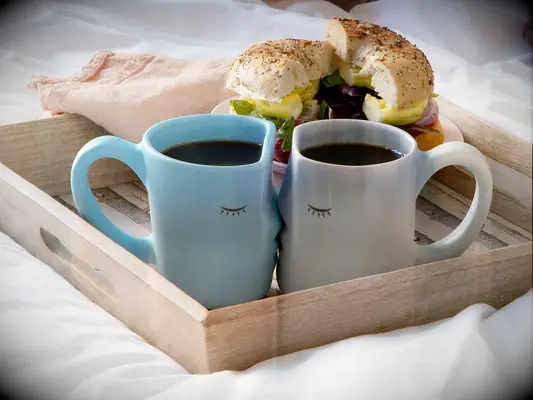 Pair of porcelain mugs kissing traditional 18-year anniversary gift