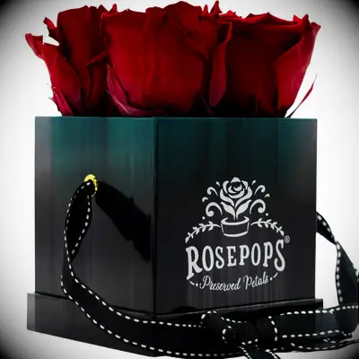 Preserved red roses in black hat box wedding gift for coworker