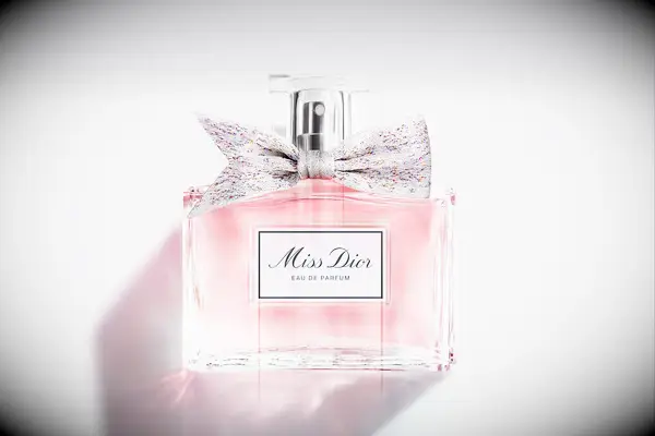 Bottle of Miss Dior perfume with a bow around the nozzle wedding gift for sister