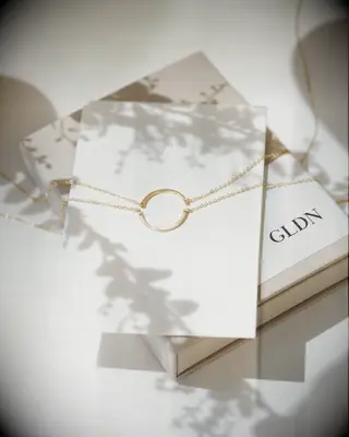 Dainty gold friendship necklaces that each depict half of a circle wedding gift for sister