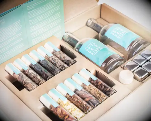 Whiskey making kit with bottles and spices for DIY anniversary gift