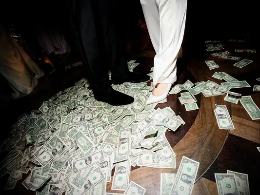 Couple standing on money