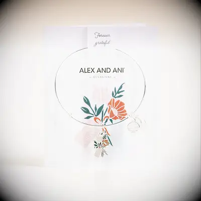 Slim silver bracelet with a bouquet charm on it thank-you gift