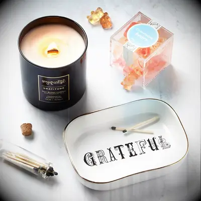 Thank-you gift set featuring gummy bears, a candle, and a jewelry dish