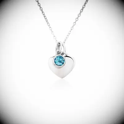 Silver heart-shaped pendant necklace with blue topaz stone