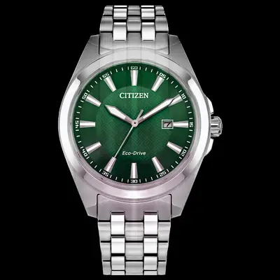 Silver metal watch with green clock face