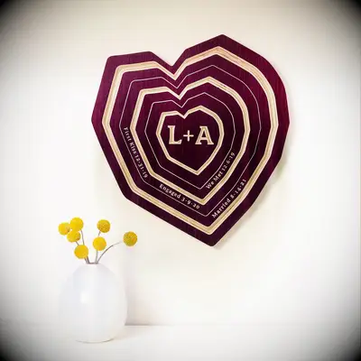 Heart-shaped wooden tree-ring art five-year anniversary gift