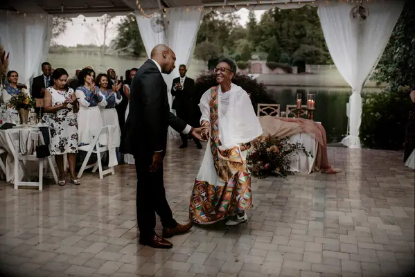Groom dancing with mother