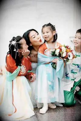 Flower Girls in Traditional Chinese Dresses With Colorful Bouquets