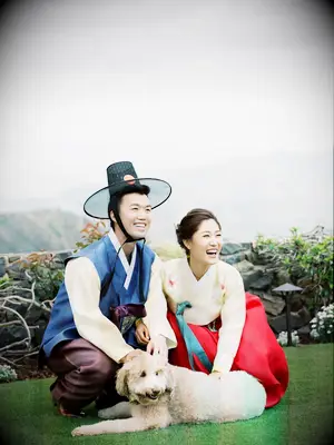 Couple on wedding day with dog