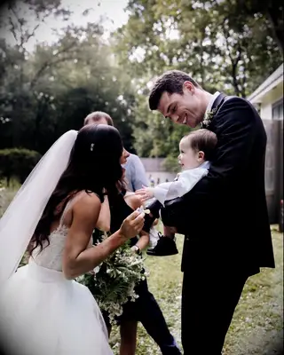 Matt Anderson with his wife and son on their wedding day