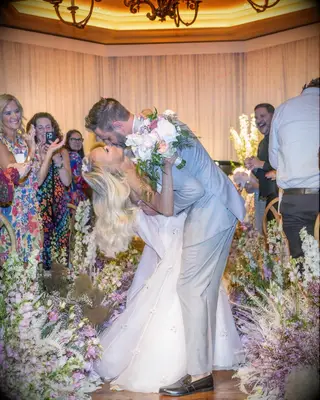 Kristin Chenoweth kissing Josh Bryant after their wedding ceremony