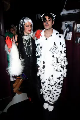 Mia Swier and Darren Criss as Cruella De Vil and a Dalmatian