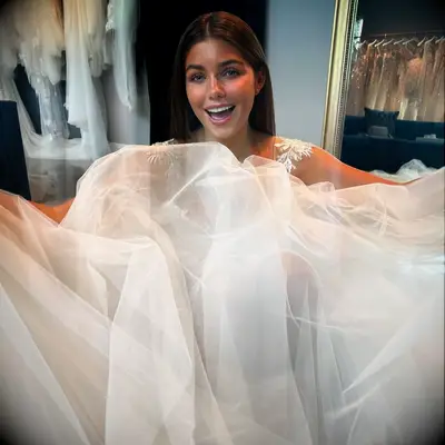 Hannah Ann trying on a wedding dress