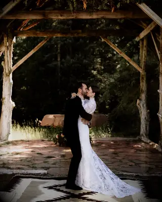 Lily Collins and Charlie McDowell kissing on their wedding day