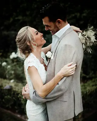 Mary and Romain Bonnet smiling together on second wedding day