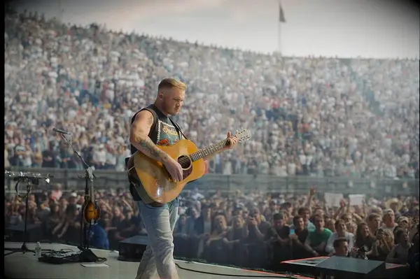 Zach Bryan performing at Forest Hills stadium